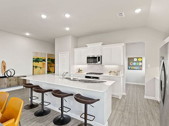 Kitchen in the Diamond home plan by Trophy Signature Homes - REPRESENTATIVE PHOTO