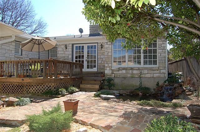 BEAUTIFULLY LANDSCAPED BACKYARD WITH DECK AND KOI POND