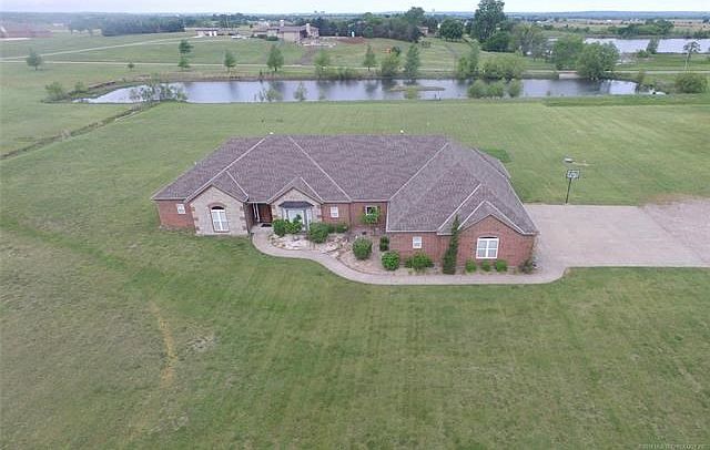 17649 N 4013 Drive in Bison Run on 5 acres, where executive and country living meet! Home includes Private Fishing Pond.