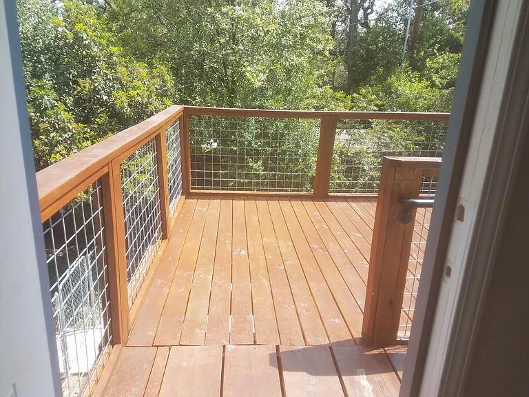 Large Deck over secure parking area. Off Entry to Apartment.