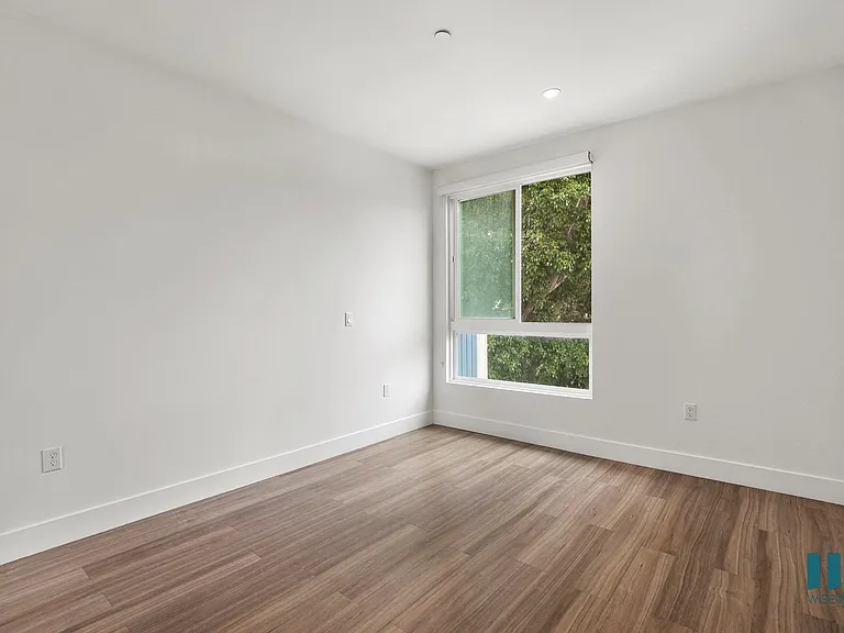Bedroom with Large Windows, Recessed Lighting, and Vinyl Flooring