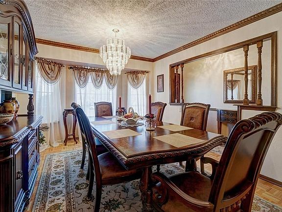 Formal dining room with bay window.