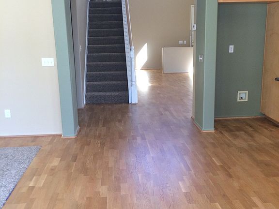 View showing floor from between family room and kitchen down