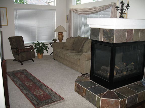 Living room with three-sided fireplace