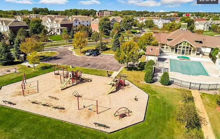 Clubhouse with swimming pool, playground and park.