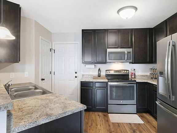upgraded kitchen with SS appliances, espresso cabinetry & pantry!
