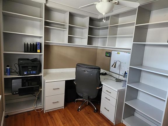 Office 1 with built-in desk & bookcases