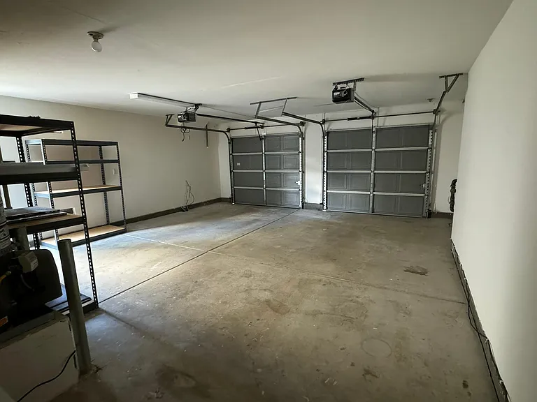 two car garage with storage racks