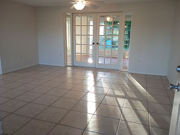Living room with french doors to lanai