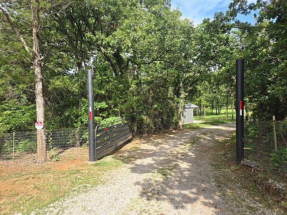Gated entry, winding drive to home with full privacy.