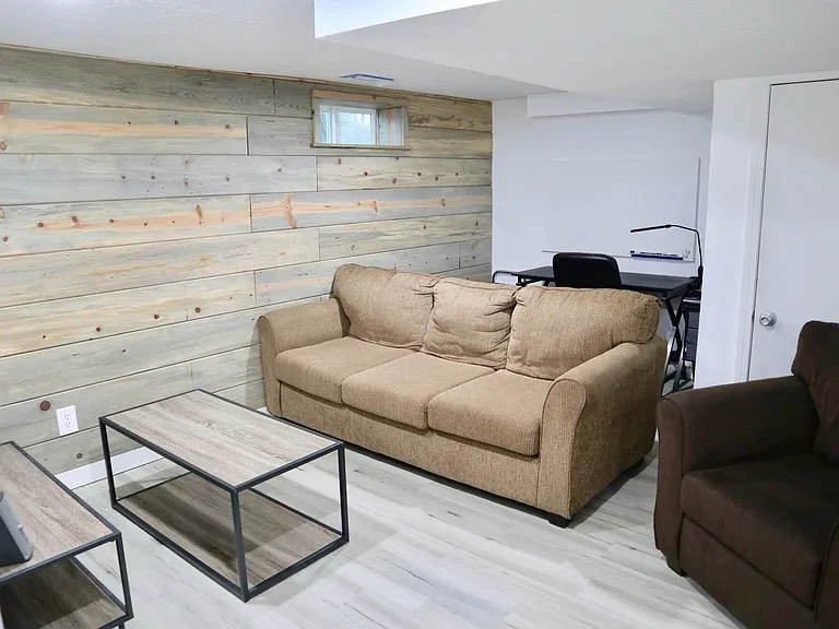 reclaimed wood walls, bocoo character in this apartment. plenty of space for couches and desk
