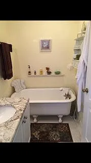 Upstairs Master bath w/footed tub.
