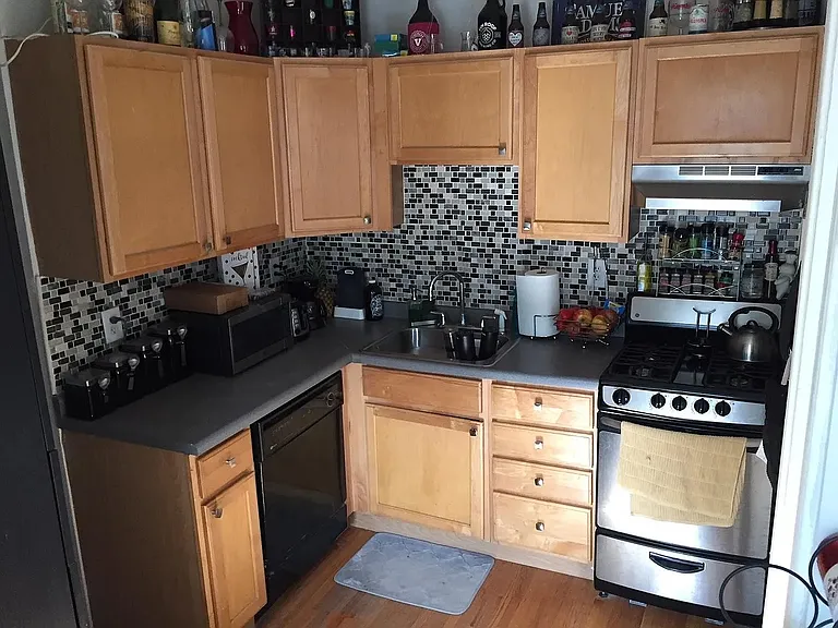 Elevate your culinary experience in this stylish kitchen from LS Capital Group. Featuring modern appliances, sleek cabinetry, and a chic backsplash, it's designed for both functionality and aesthetics. Explore your new home today!
