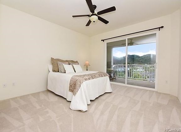 Very spacious Master bedroom with open lanai right  and views of mountains.