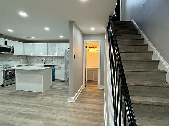 Kitchen, view of bathroom and main stairway