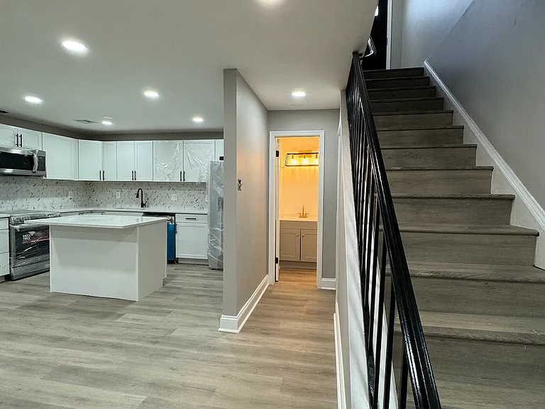 Kitchen, view of bathroom and main stairway