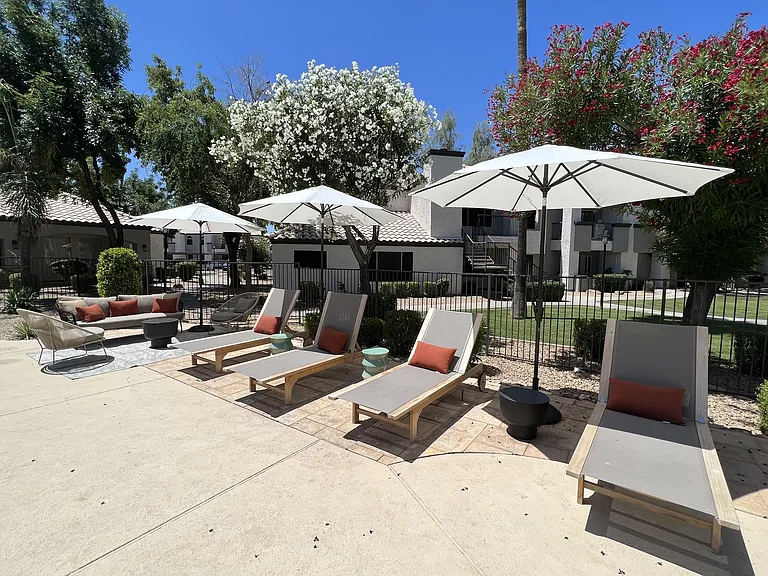 Enjoy our courtyard's lounge chairs and shaded umbrellas for a relaxing outdoor retreat