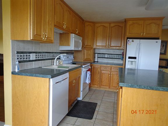 kitchen with ceramic floor & oak cabinets