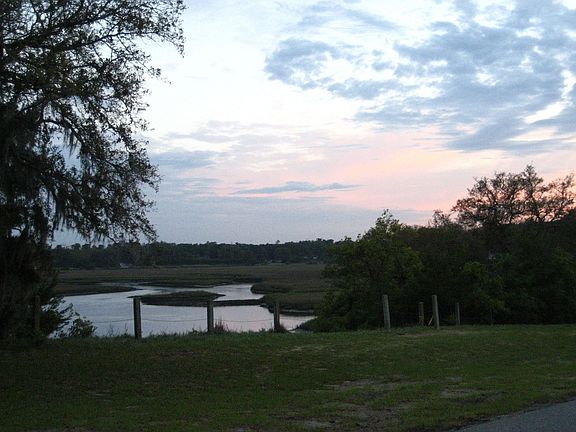 Greenscape runs along the water throughout the neighborhood 