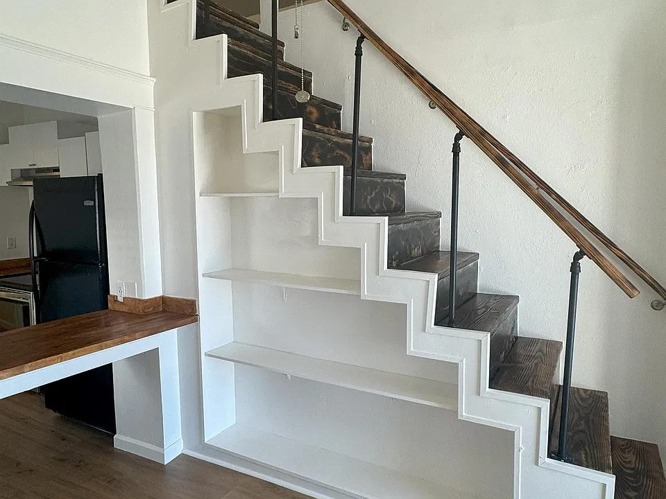 Shelving on the Side of Stairs.