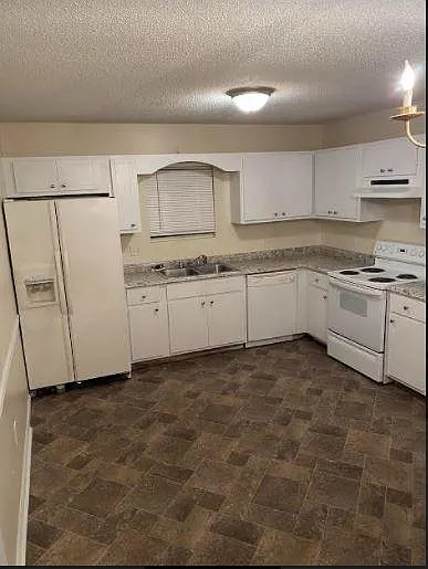 Kitchen area with NEW fridge (not pictured)