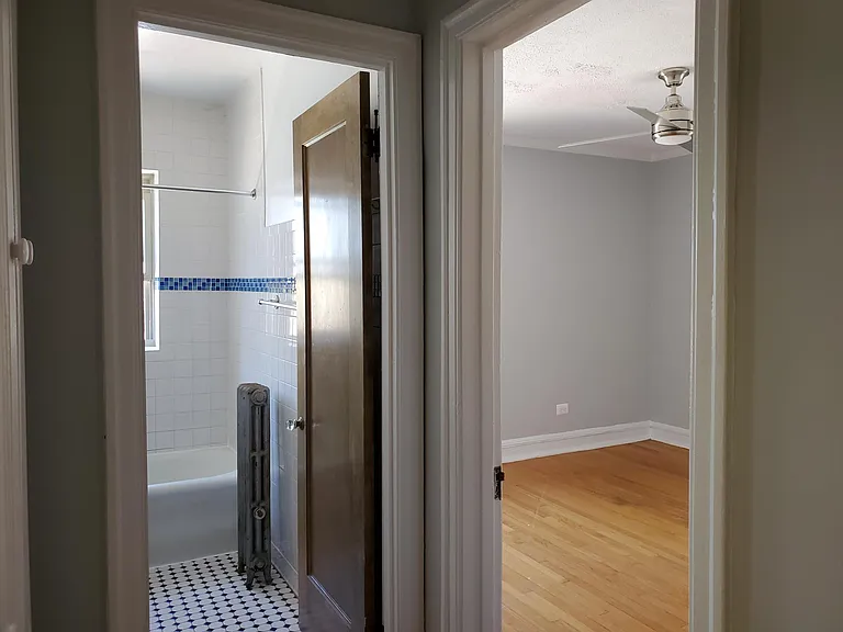 standing in foyor . linen closet on the left, bathroom and looking into bedroom