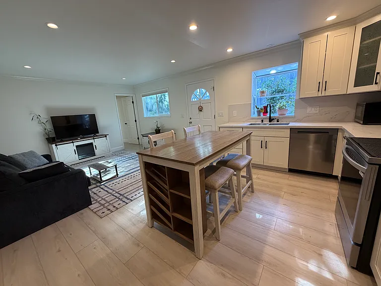 Dining area, kitchen, and living room.