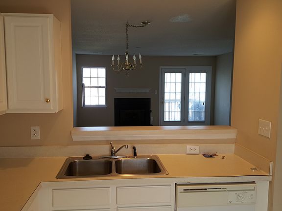 Kitchen looking through pass through to the DR and LR