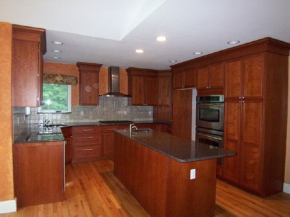 Gourmet Kitchen with Double Sided Fireplace and Granite Breakfast Bar