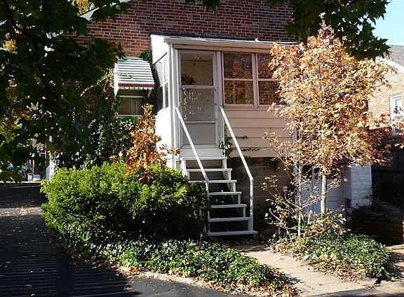 This shows the stairs to the back entrance. See the tuck under garage on the right side.