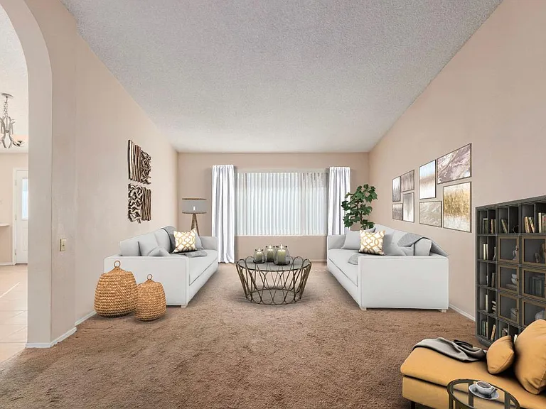 Living room when you walk in the front door boasts vaulted ceilings and tons of light!