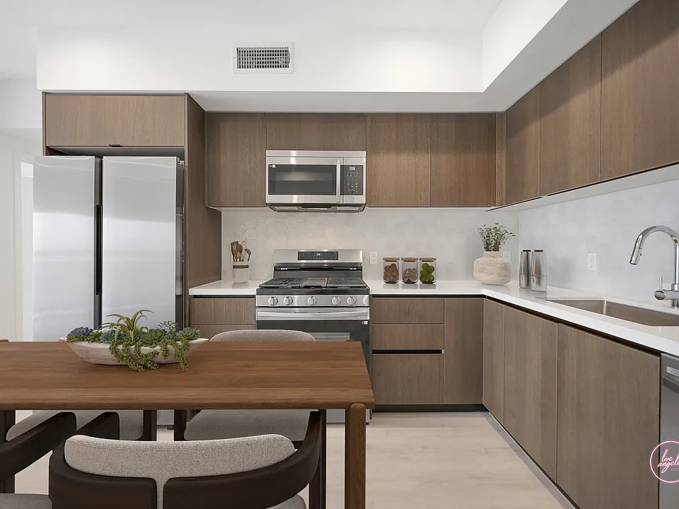 Open-Concept Kitchen with Energy-Efficient Refrigerator, Stove with Griddle Top, Microwave, and Dishwasher - Blondie Floor Plan