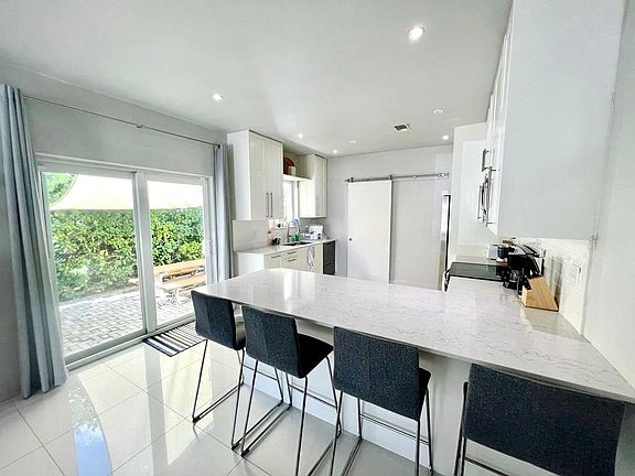 Kitchen with view of the paved patio
