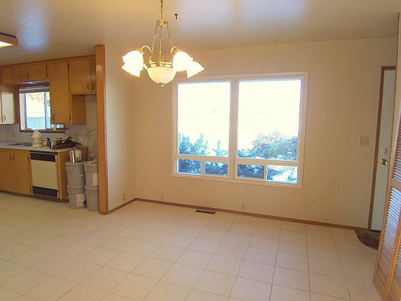 Dining space off the kitchen with tile floor