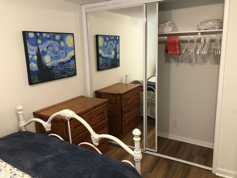 closet with extra sheets, blankets, pillows and hangers