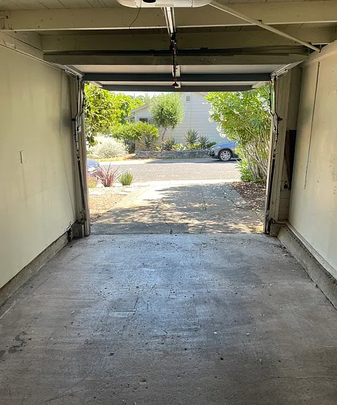 Garage w/remote opener also great space for a workout room or storage.