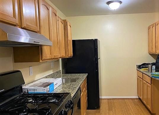 Counters and cabinets on both sides of galley kitchen mean lots of space for cooking