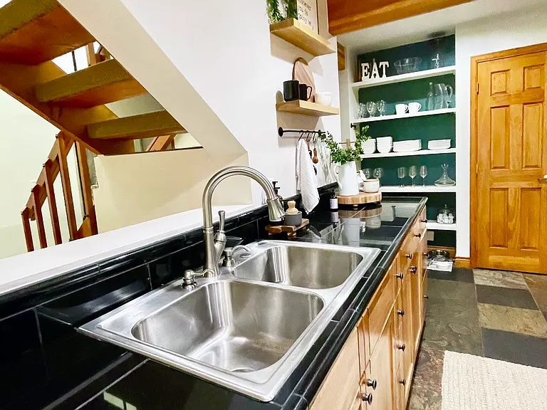 Kitchen with open shelving and pantry wall