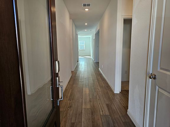Entryway. Two guest bedrooms and Full Guest bath on the right.