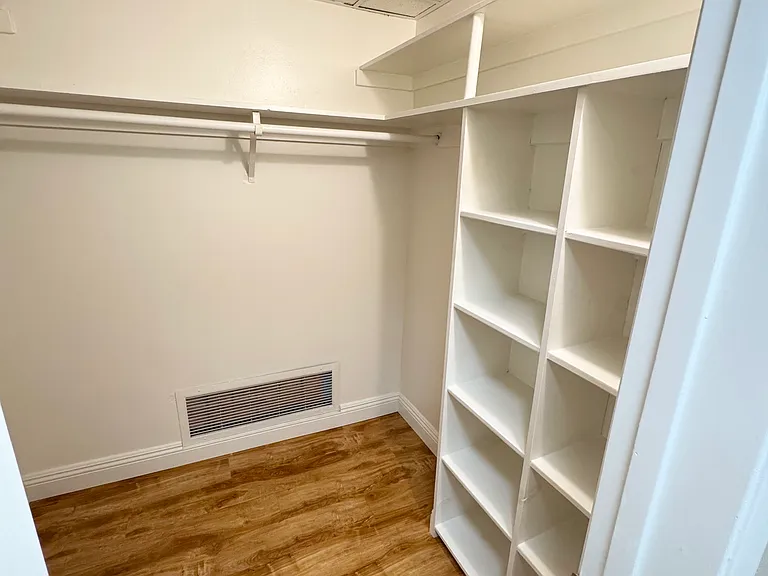 Walk in closet with tons of room for clothes and shoes