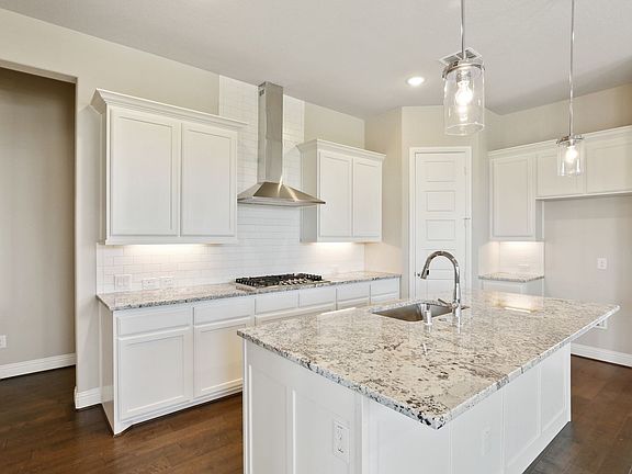 Kitchen in the Claridge home plan by Trophy Signature Homes