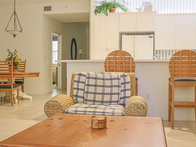 Living area off of kitchen and sliders to patio