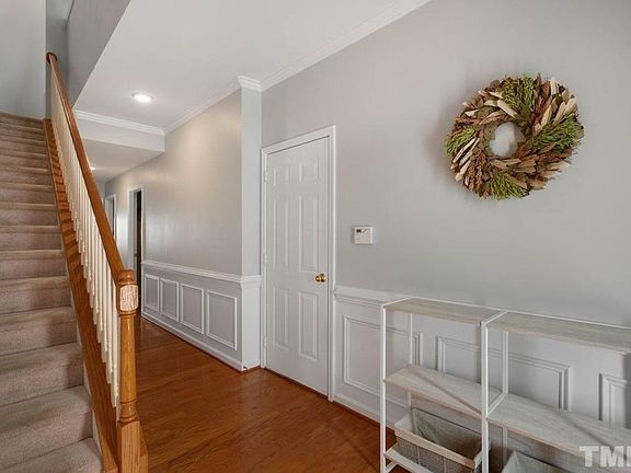 Entrance Foyer - A bedroom, half bath, large walk-in closet, and the garage are located on this main level.