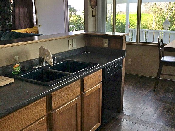 Kitchen is open to living room and breakfast/dining area