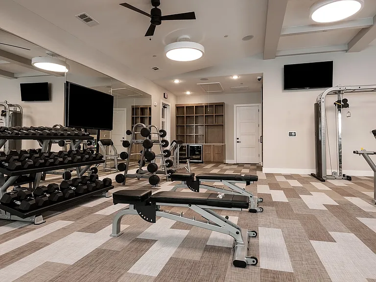 Our fitness center is complete with free weights and cardio machines.
