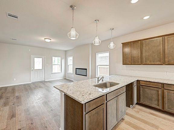 The Caldwell- Kitchen into Family Room. Home under construction. Sample floor plan photo used for i