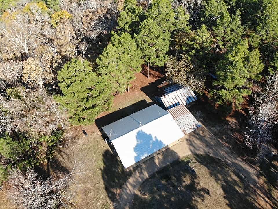 Home & Circle Drive with adjacent car port.
