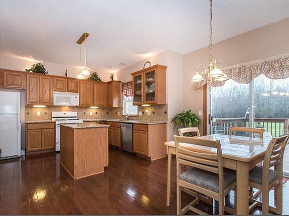 Gourmet kitchen with granite counter tops...great eating space...glass sliders to spacious deck.