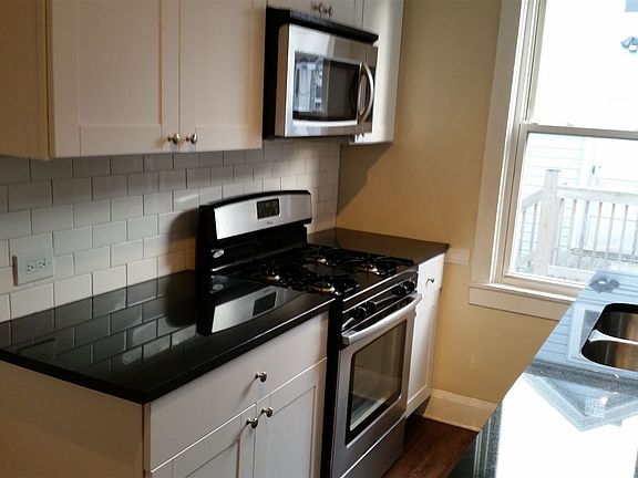 Large kitchen including Gas range, microwave, dishwasher, do