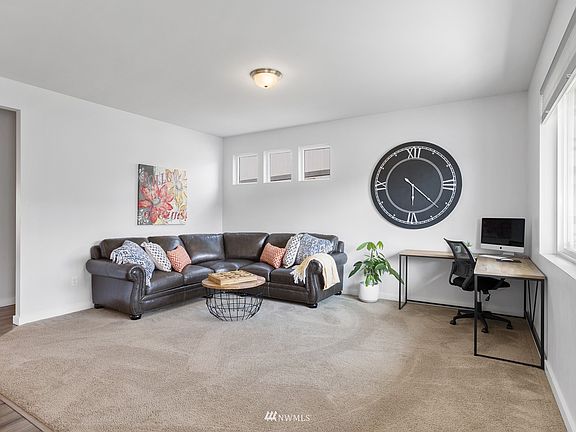 The living/great room off the entry can have multiple uses, including office area or play room.